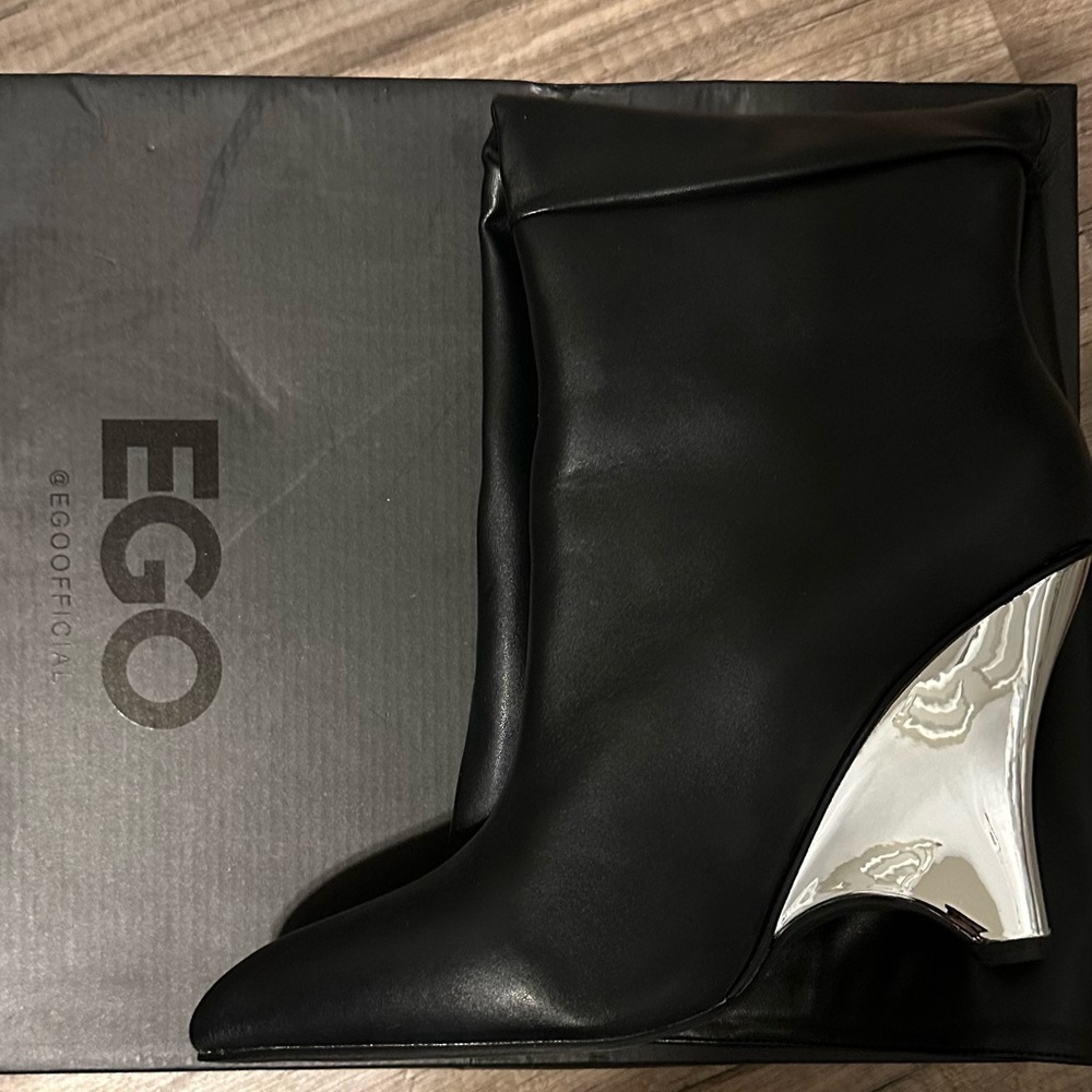 Thigh high wedge boot